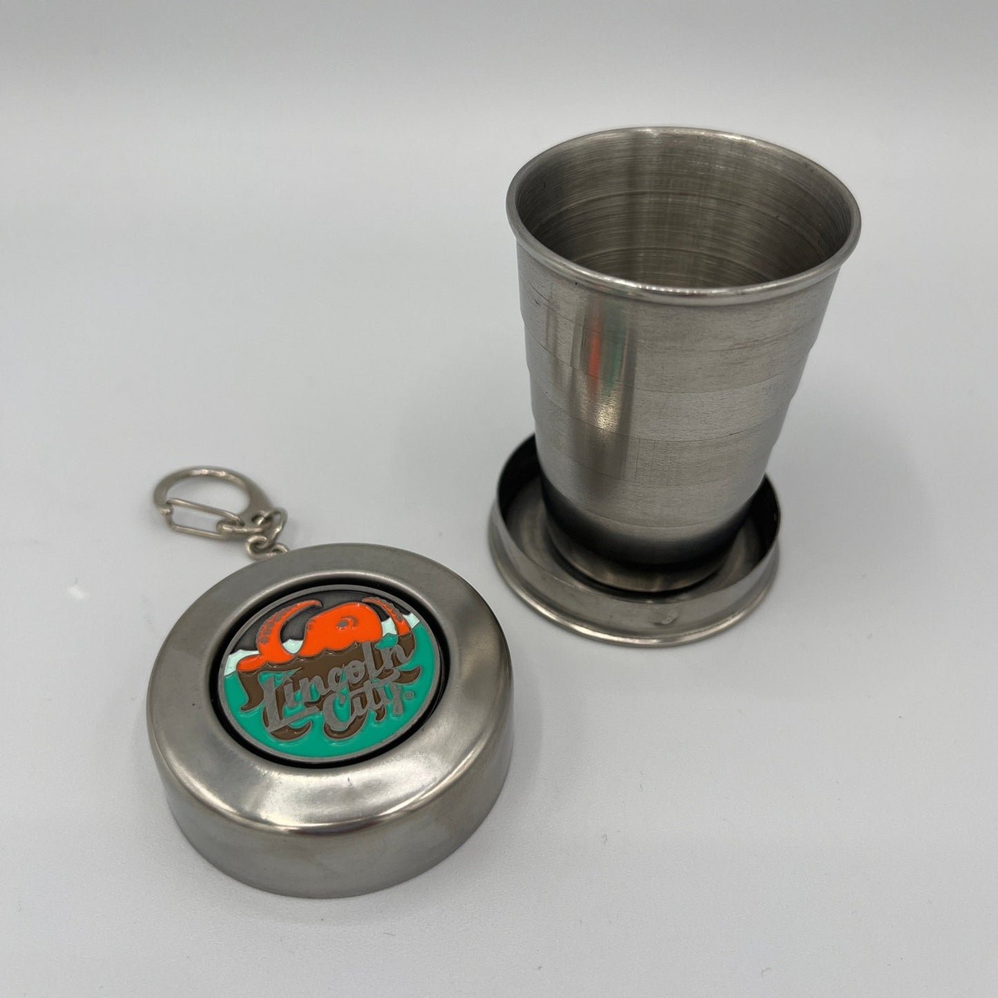 Collapsible Shot Glass Lincoln City Logo